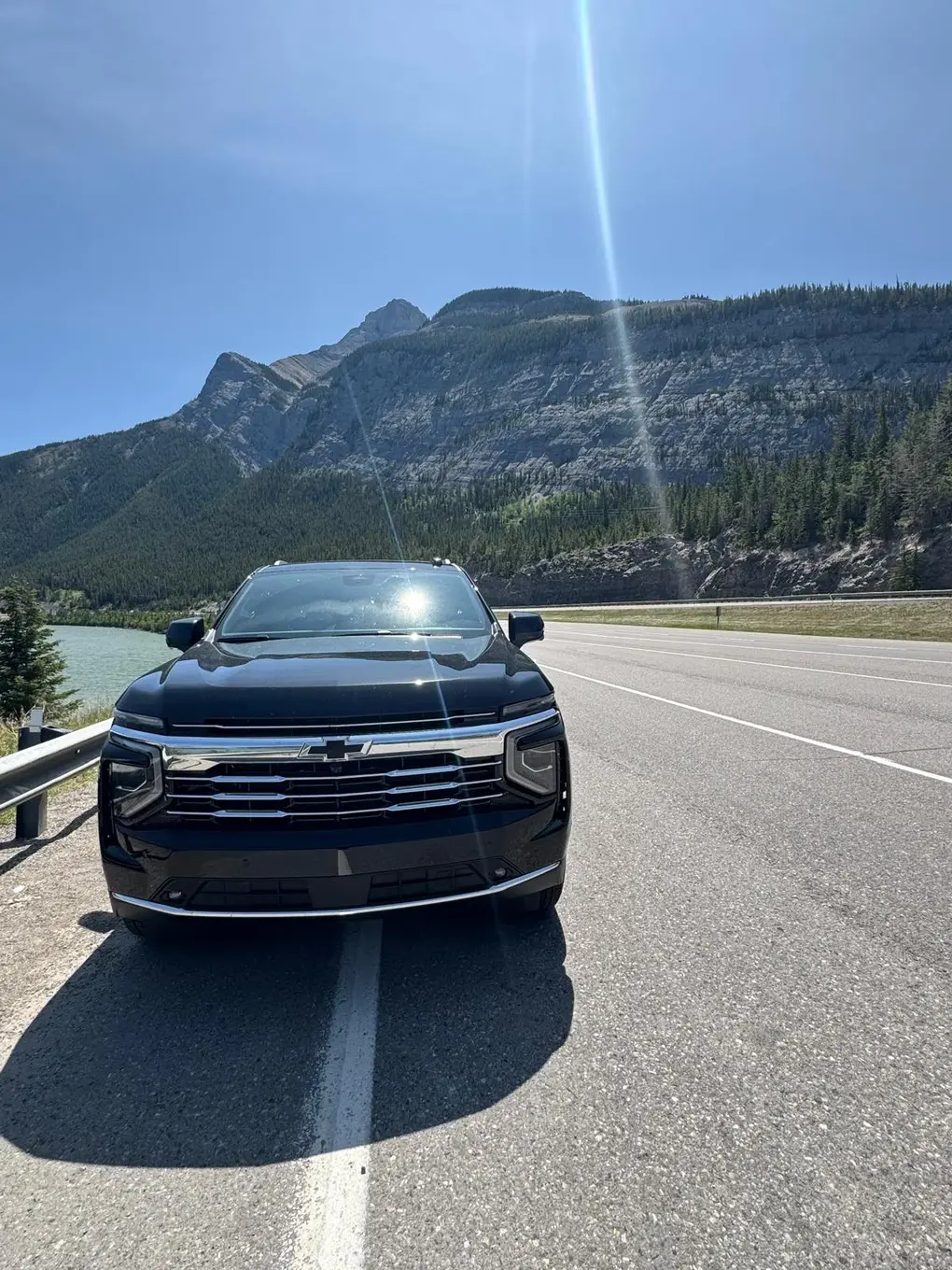 suv limo on road near banff