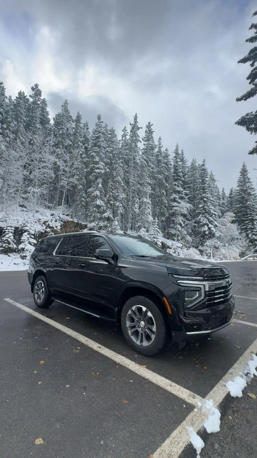 suv on banff mountain road snow